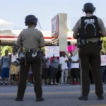Obligation the police of los angeles to pay two millions of dollars to a demostrat

 Arabausa
